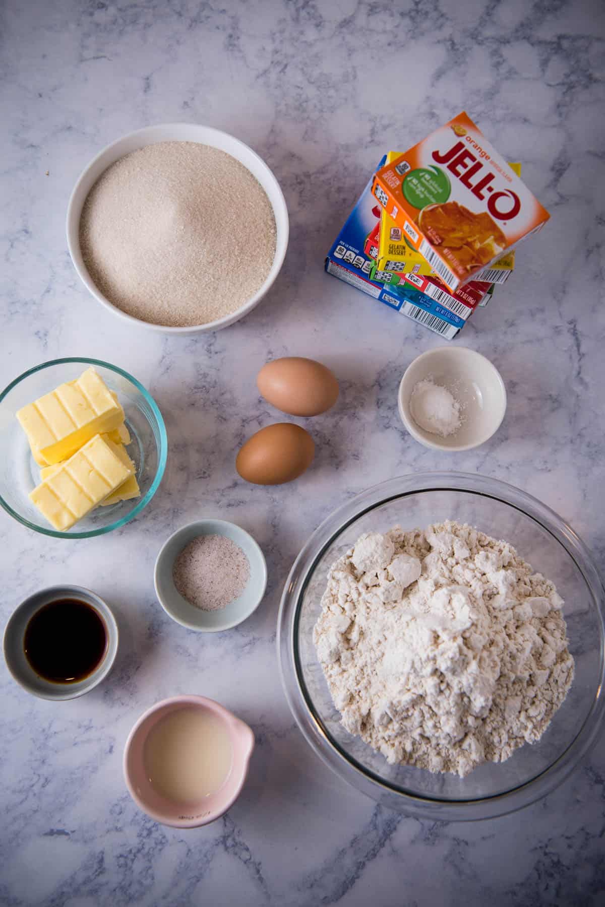 Jello cookie recipe ingredients on white marble countertop