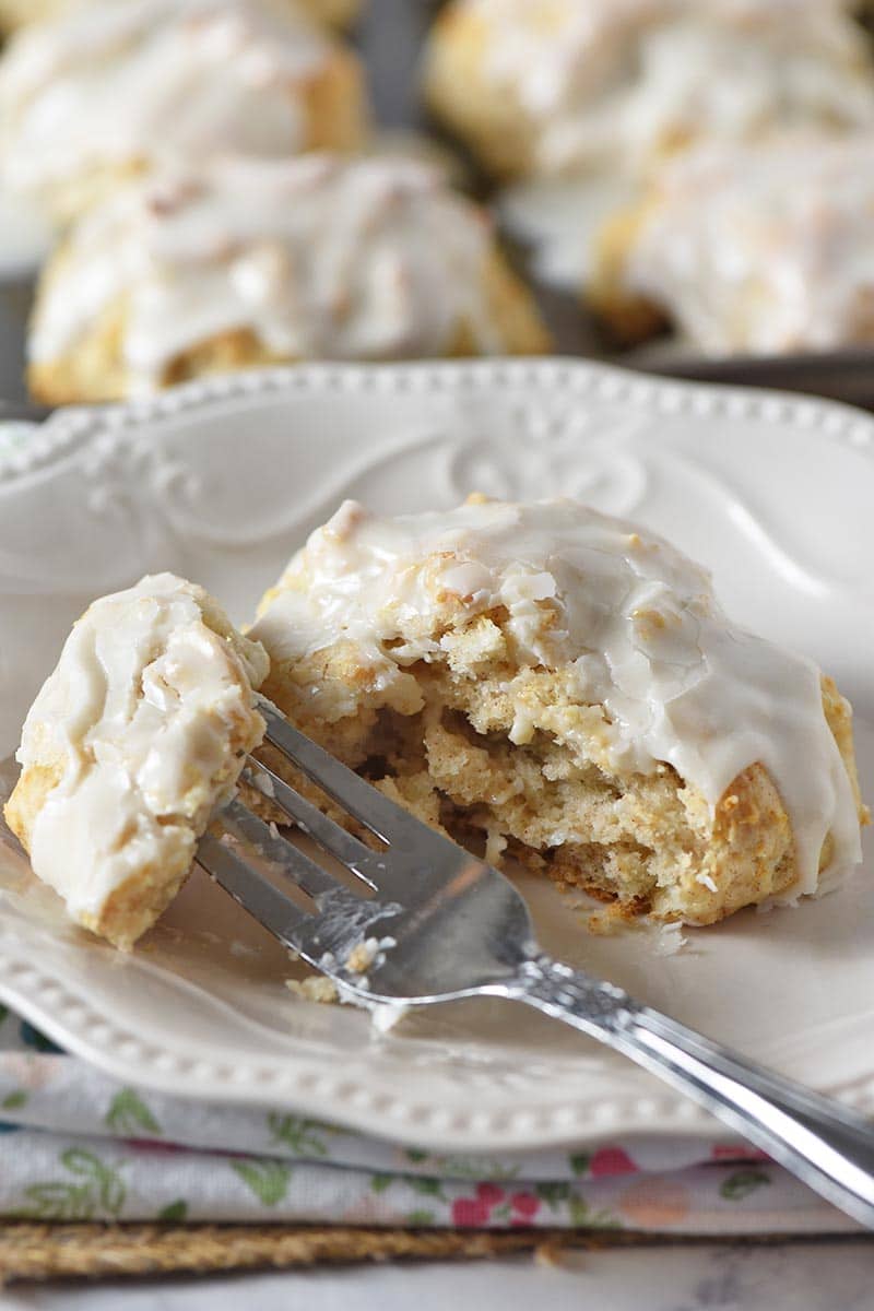 bite of Bisquick cinnamon biscuit on fork on white plate