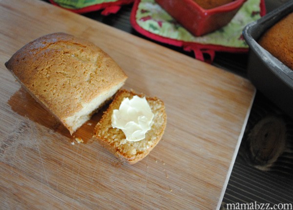 sliced ginger loaf with butter on wood cutting board