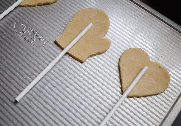 cookie pop sticks on Valentines cookie pops before baking on baking sheet