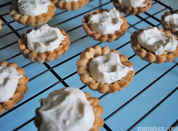 Add cream cheese filling to tarts