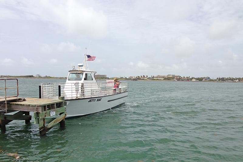 Jetty Boat docked on San Jose Island, waiting for passengers