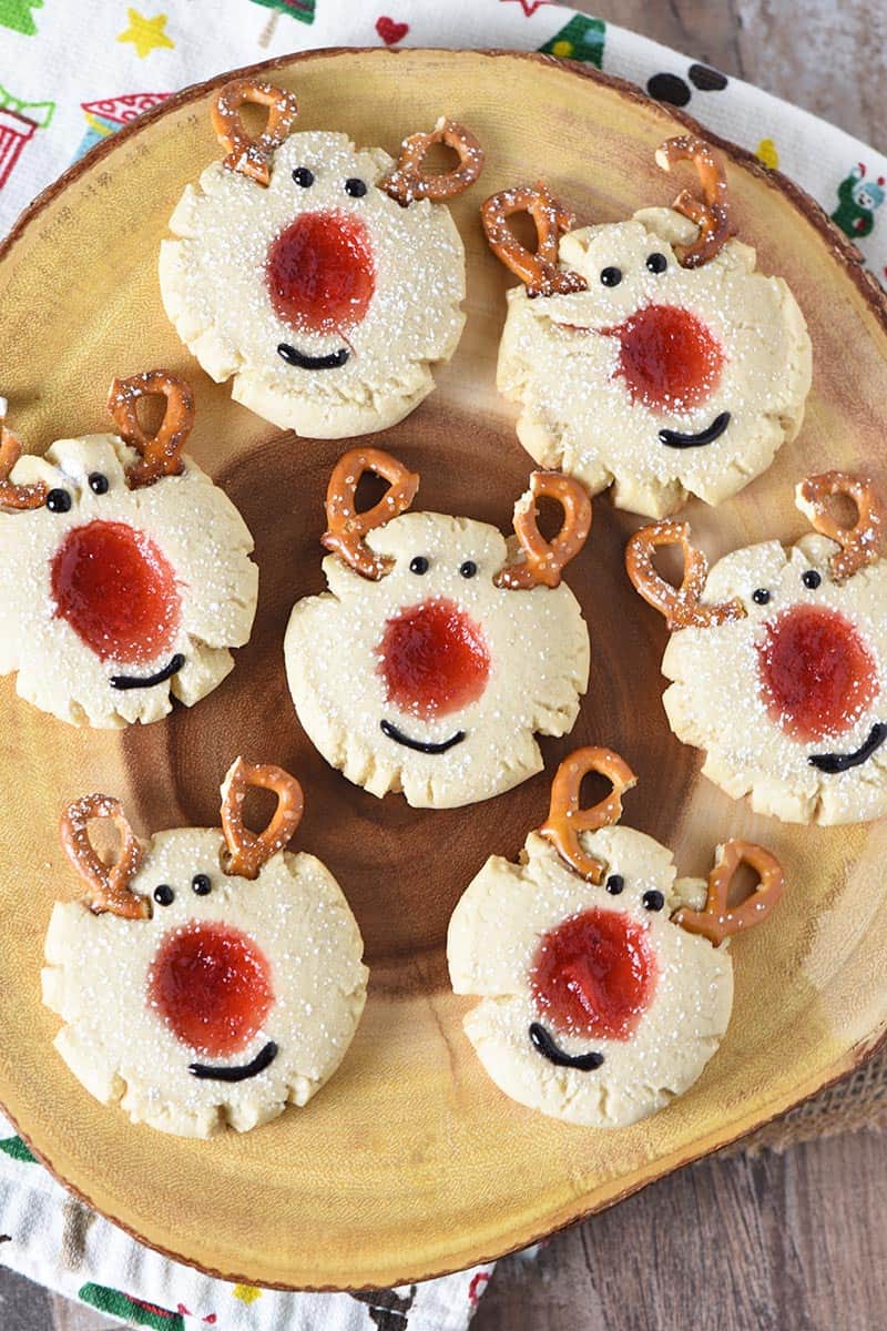 log platter full of reindeer thumbprint cookies for Christmas and the holidays
