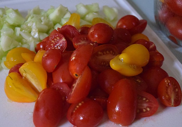 Rotini pasta coated with a lightly creamy dressing, mixed with fresh cucumbers, tomatoes, smoked cheese, and other delicious ingredients. Easy 30 minute pasta salad recipe!
