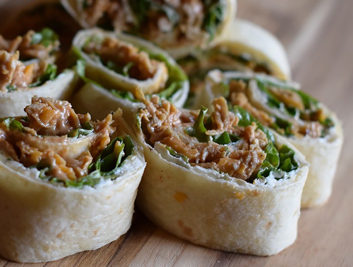 We may enjoy the commercials more than the actual game, but when it comes to Superbowl food or Game Day snacks, these chicken appetizers have got it goin’ on. Chicken Dip Pinwheels pack a flavor-filled punch and make the perfect bite-sized party appetizers or snacks.