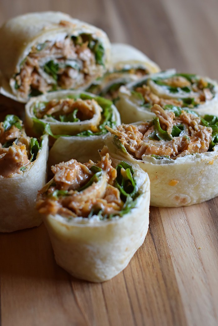 We may enjoy the commercials more than the actual game, but when it comes to Superbowl food or Game Day snacks, these chicken appetizers have got it goin’ on. Chicken Dip Pinwheels pack a flavor-filled punch and make the perfect bite-sized party appetizers or snacks.