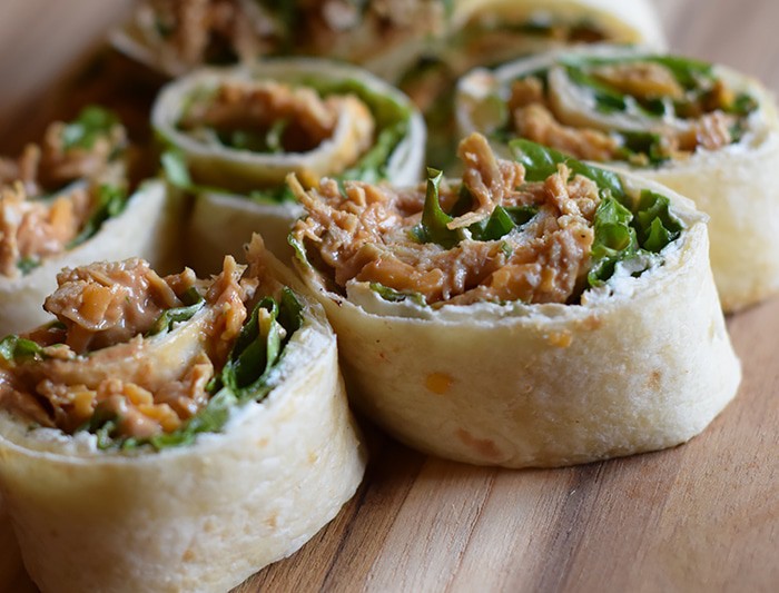 We may enjoy the commercials more than the actual game, but when it comes to Superbowl food or Game Day snacks, these chicken appetizers have got it goin’ on. Chicken Dip Pinwheels pack a flavor-filled punch and make the perfect bite-sized party appetizers or snacks.