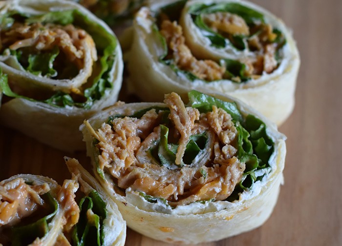 We may enjoy the commercials more than the actual game, but when it comes to Superbowl food or Game Day snacks, these chicken appetizers have got it goin’ on. Chicken Dip Pinwheels pack a flavor-filled punch and make the perfect bite-sized party appetizers or snacks.