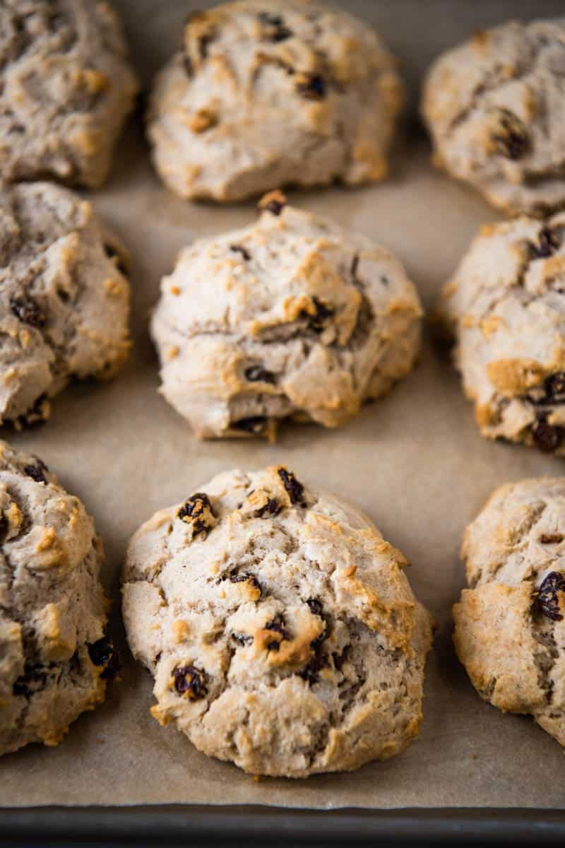 golden baked Irish soda bread scones on parchment covered baking sheet