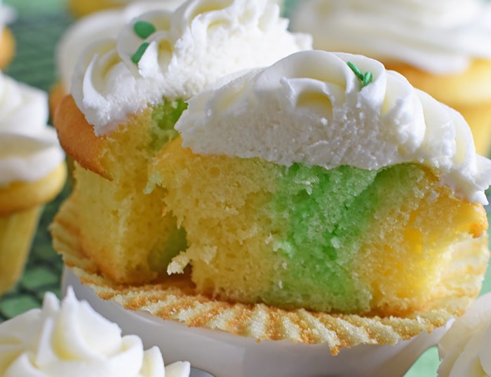 Jello cake (or poke cake) has always been one of my favorites. Learn how to make Lime Vanilla Poke Cake Cupcakes with buttercream frosting. These scrumptious cupcakes bring just a hint of green for a festive St Patricks Day or any day really.
