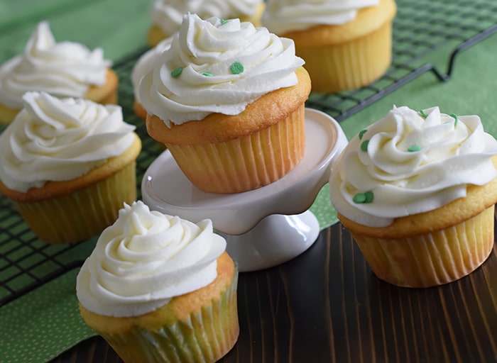 Jello cake (or poke cake) has always been one of my favorites. Learn how to make Lime Vanilla Poke Cake Cupcakes with buttercream frosting. These scrumptious cupcakes bring just a hint of green for a festive St Patricks Day or any day really.
