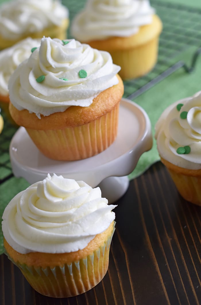 Jello cake (or poke cake) has always been one of my favorites. Learn how to make Lime Vanilla Poke Cake Cupcakes with buttercream frosting. These scrumptious cupcakes bring just a hint of green for a festive St Patricks Day or any day really.