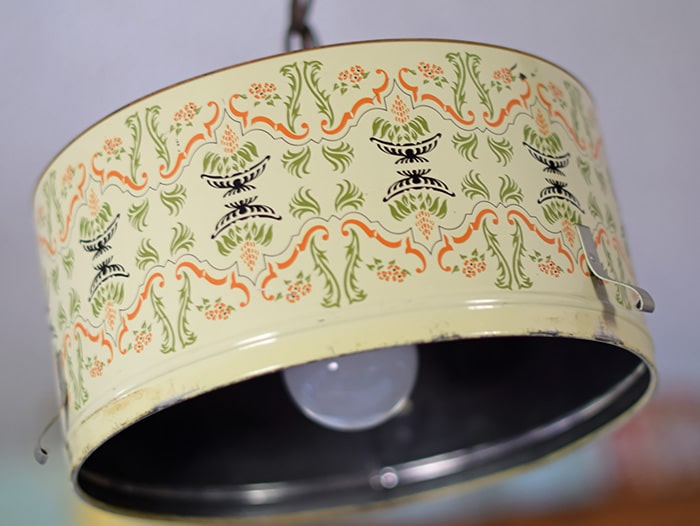 Create a farmhouse kitchen look with DIY light fixtures upcycled from vintage cake tins. How to create a charming look with affordable and simple kitchen lighting.
