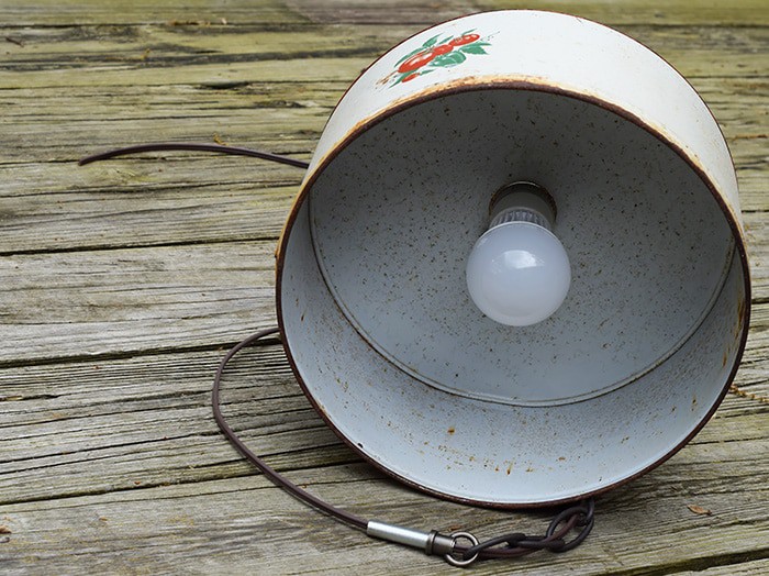 Create a farmhouse kitchen look with DIY light fixtures upcycled from vintage cake tins. How to create a charming look with affordable and simple kitchen lighting.