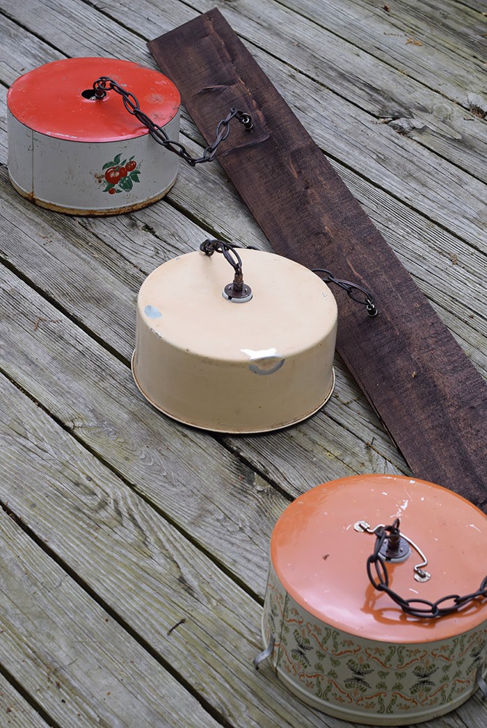 Create a farmhouse kitchen look with DIY light fixtures upcycled from vintage cake tins. How to create a charming look with affordable and simple kitchen lighting.