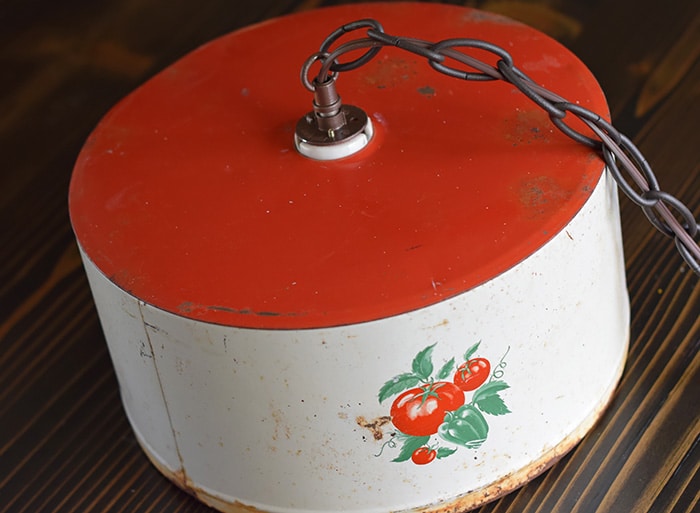 Create a farmhouse kitchen look with DIY light fixtures upcycled from vintage cake tins. How to create a charming look with affordable and simple kitchen lighting.