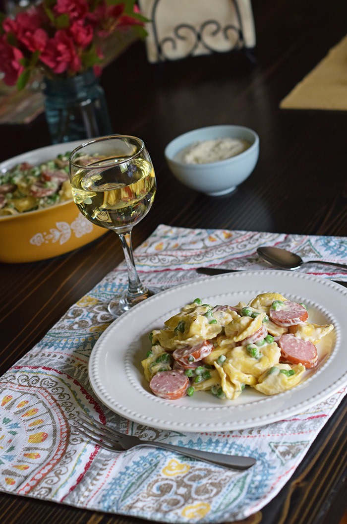 Bring your family back to the dinner table with a spring inspired, Tuscany inspired recipe for Creamy Tortellini Alfredo, a simple family dinner recipe that takes very little time to make, giving you more time with the ones you love. And don’t forget to add a few special touches to the table; after all, it’s the little things in life that are worth celebrating.