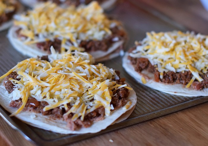 Homemade is way better, especially when it comes to Homemade Mexican Pizza with All the Fixin’s, like lettuce, tomatoes, and avocados. Enjoy a simple recipe that makes a delicious family meal and curbs those cravings for your favorite Mexican and Tex-Mex food.