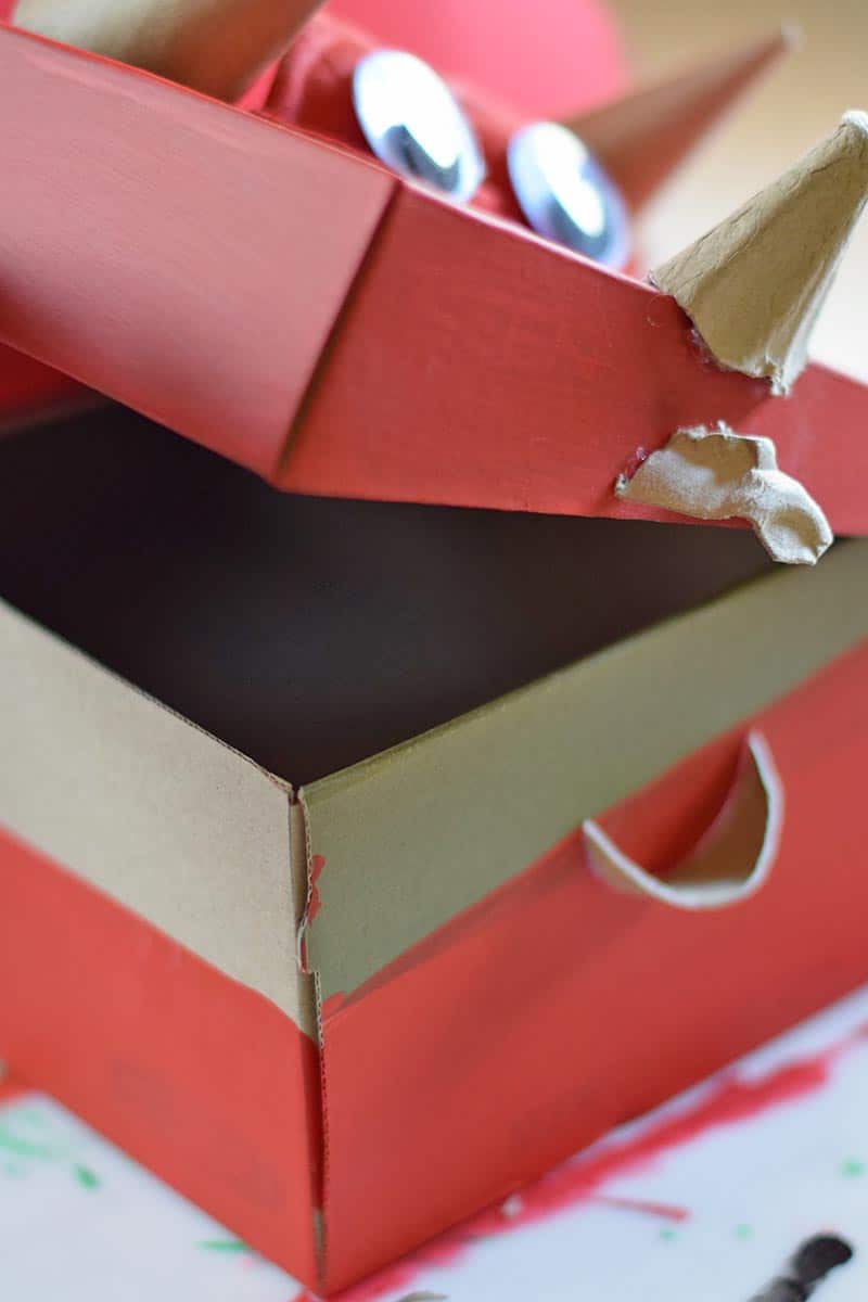 open lid of red triceratops Valentine box