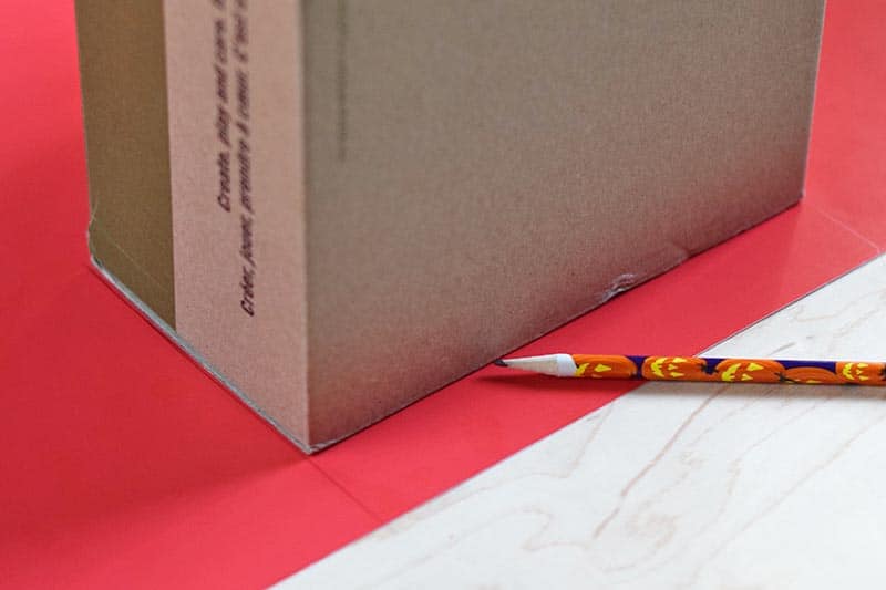 measuring shoebox for red poster board dinosaur crest