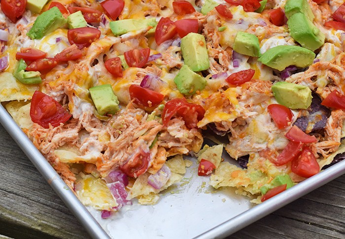Hungry for loaded nachos and Tex-Mex but don’t feel like going out? Make the most flavorful loaded nachos with chicken and roasted red pepper hummus, along with other favorite ingredients like cheese, tomatoes, avocado, and more. Chicken and Hummus Loaded Nachos in a Sheet Pan Recipe!