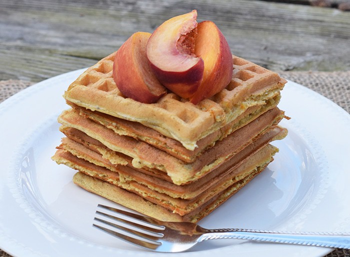 With peaches in the batter and peaches sliced on top, Peaches and Cream Waffles have a light peachy taste with a hint of cinnamon. Top them off with whipped cream and real maple syrup, and serve for a scrumptious breakfast or breakfast for dinner. Printable recipe!