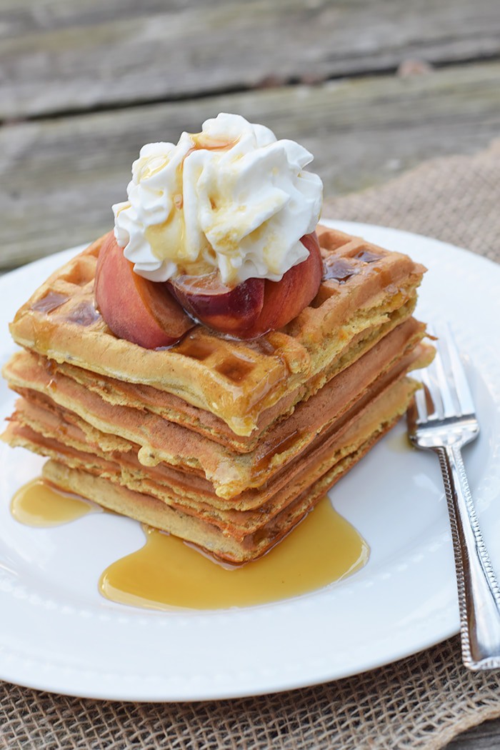 With peaches in the batter and peaches sliced on top, Peaches and Cream Waffles have a light peachy taste with a hint of cinnamon. Top them off with whipped cream and real maple syrup, and serve for a scrumptious breakfast or breakfast for dinner. Printable recipe!