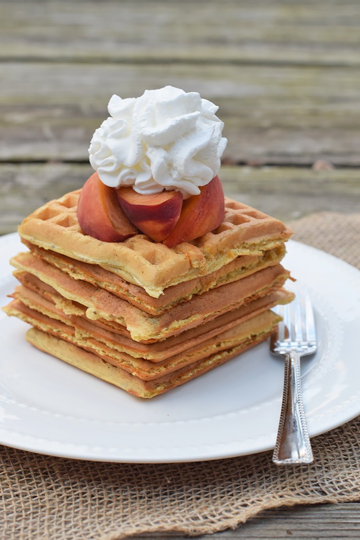 With peaches in the batter and peaches sliced on top, Peaches and Cream Waffles have a light peachy taste with a hint of cinnamon. Top them off with whipped cream and real maple syrup, and serve for a scrumptious breakfast or breakfast for dinner. Printable recipe!