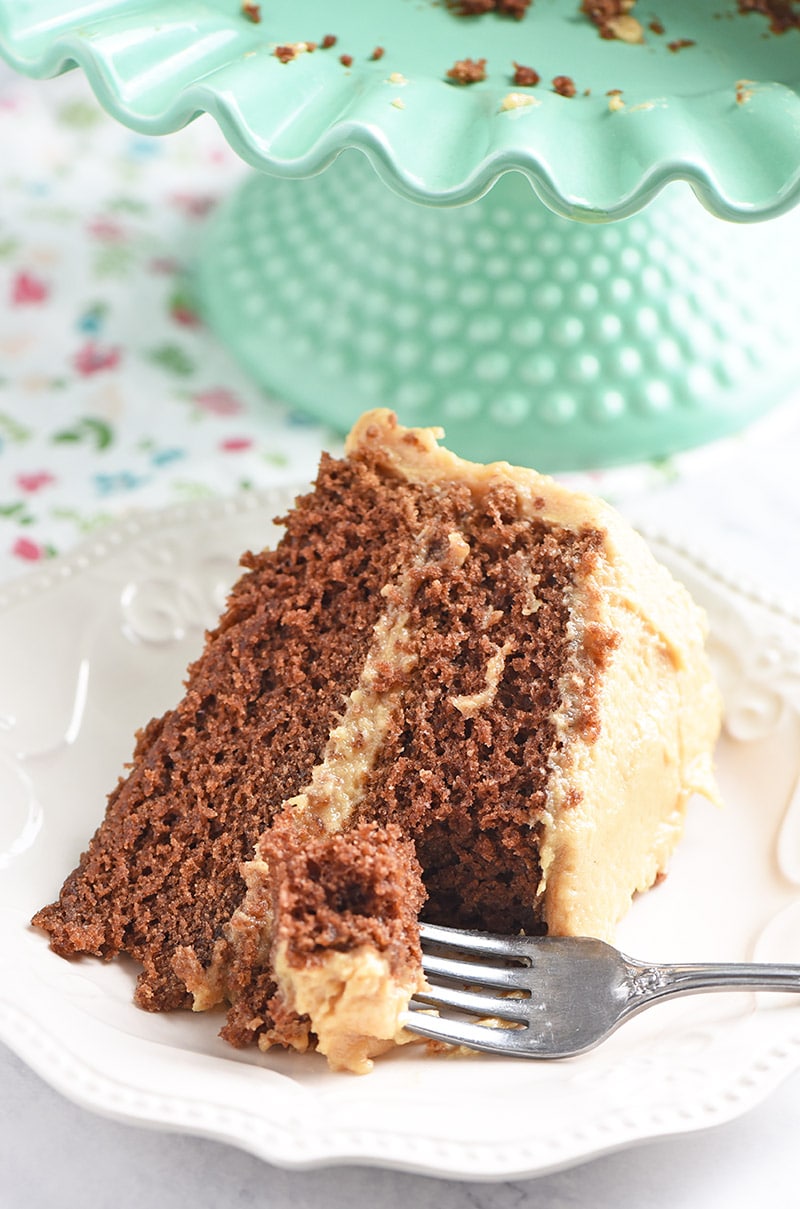Bite out of peanut butter chocolate cake slice