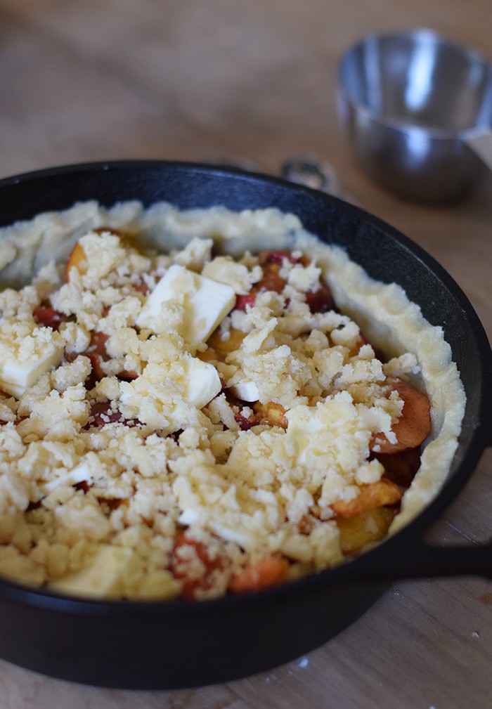 Peach cobbler is probably the easiest dessert recipe, besides chocolate chip cookies, you could ever make. Ingredients are simple, and the crust is a press-in crust, my favorite type of pie crust! Grab the recipe, bake it up in your favorite cast iron skillet (or baking dish), serve with vanilla ice cream, and watch it disappear.