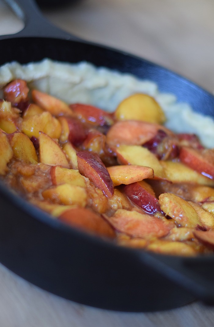 Peach cobbler is probably the easiest dessert recipe, besides chocolate chip cookies, you could ever make. Ingredients are simple, and the crust is a press-in crust, my favorite type of pie crust! Grab the recipe, bake it up in your favorite cast iron skillet (or baking dish), serve with vanilla ice cream, and watch it disappear.
