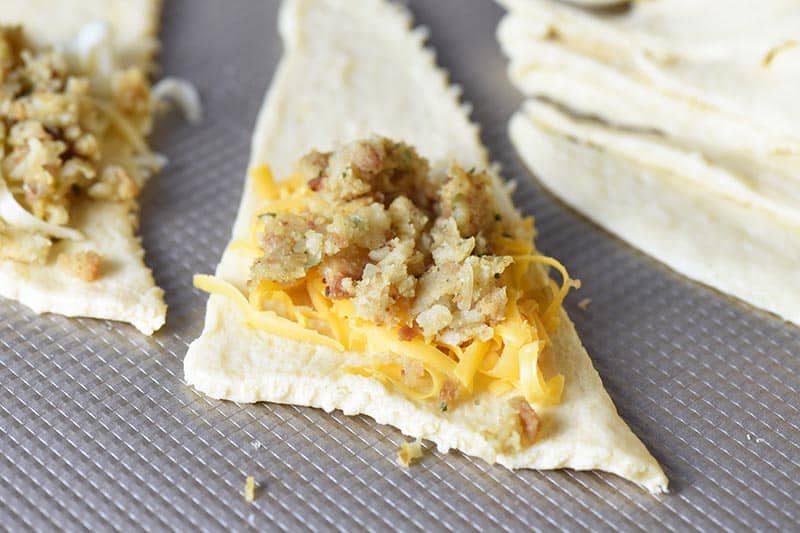 leftover turkey and stuffing with cheddar cheese on crescent roll dough