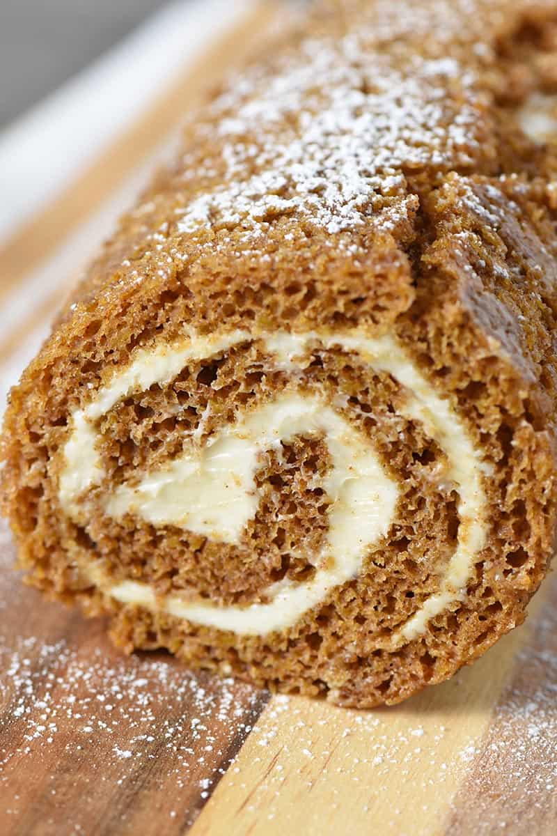 pumpkin roll on wooden cutting board