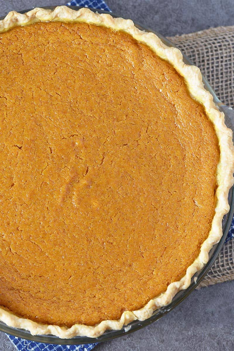 old-fashioned sweet potato pie in baking dish on dark gray countertop