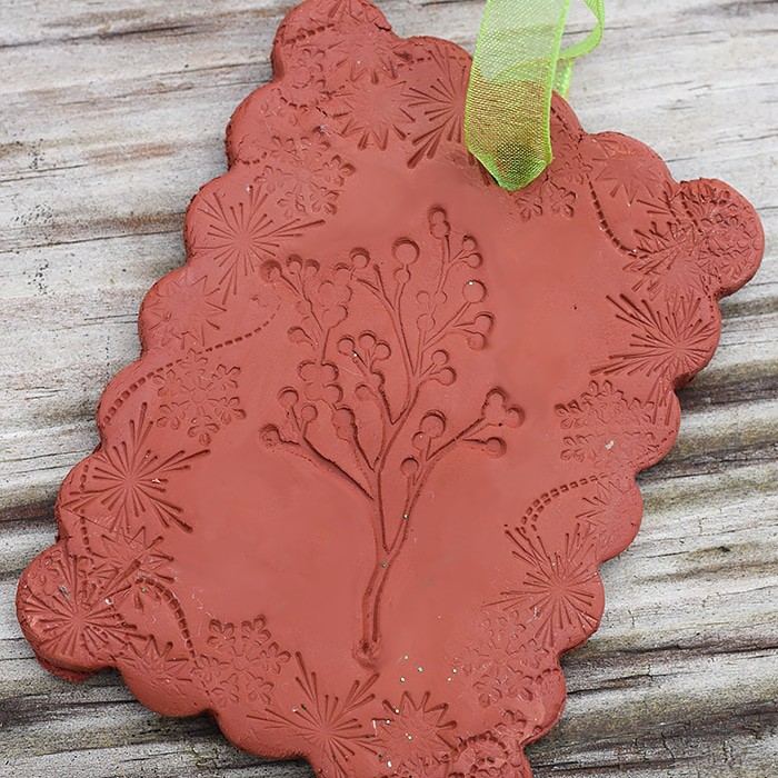 Use Air-Dry Clay, Christmas cookie cutters, and acrylic stamps to make the simplest of crafts, Clay Diffuser Ornaments. They're beautifully festive decorations for the Christmas season, and they add a touch of essential oil scents to both your tree and home.