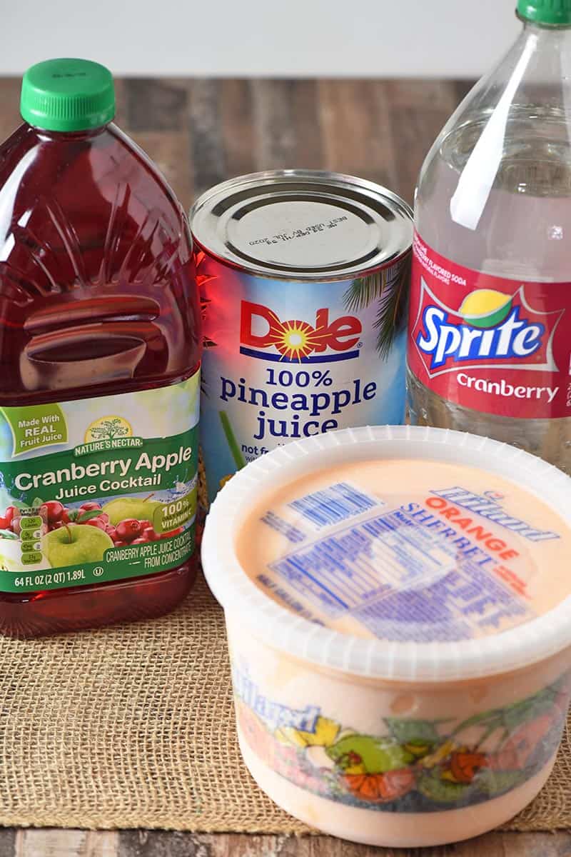 ingredients for making orange sherbet punch recipe, including pineapple juice, cranberry apple juice, Cranberry Sprite, and orange sherbet