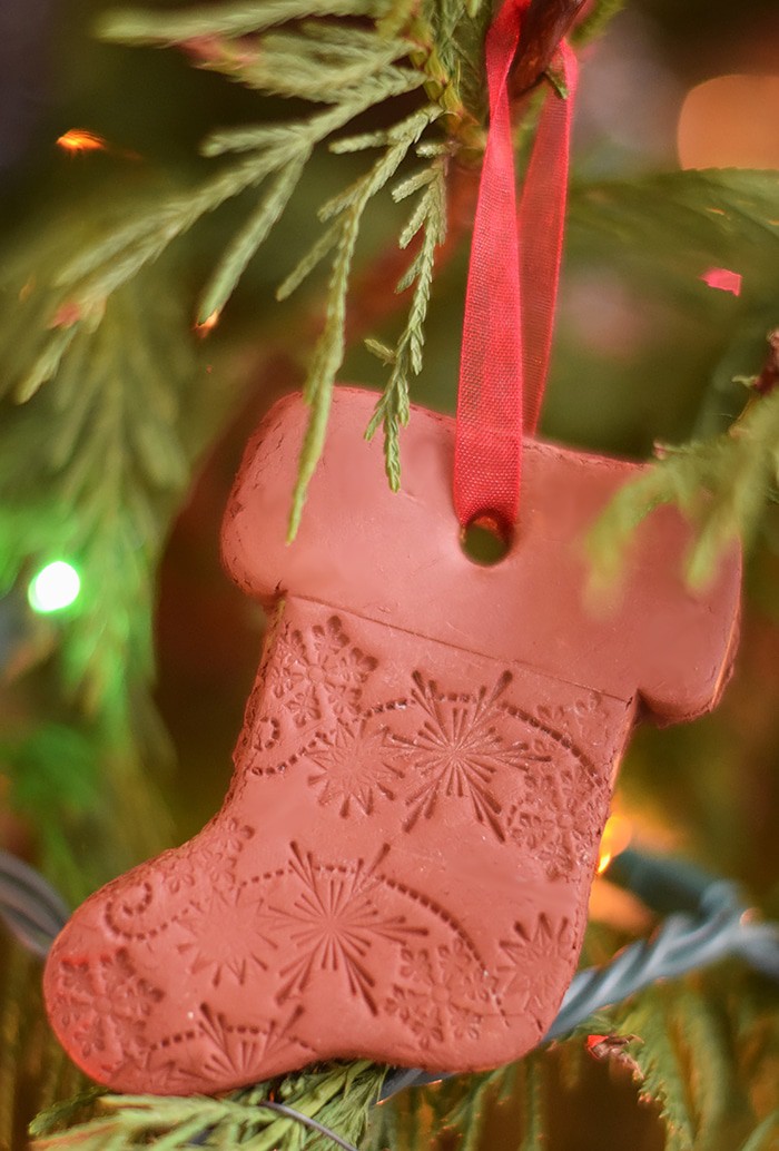 Use Air-Dry Clay, Christmas cookie cutters, and acrylic stamps to make the simplest of crafts, Clay Diffuser Ornaments. They're beautifully festive decorations for the Christmas season, and they add a touch of essential oil scents to both your tree and home.