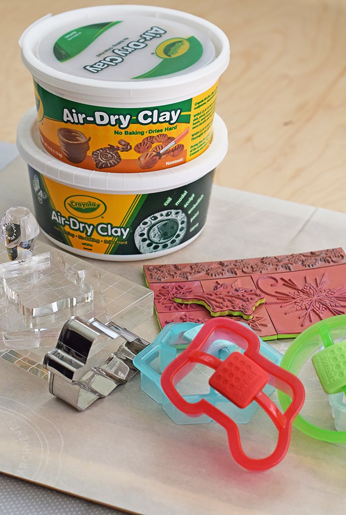 Use Air-Dry Clay, Christmas cookie cutters, and acrylic stamps to make the simplest of crafts, Clay Diffuser Ornaments. They're beautifully festive decorations for the Christmas season, and they add a touch of essential oil scents to both your tree and home.
