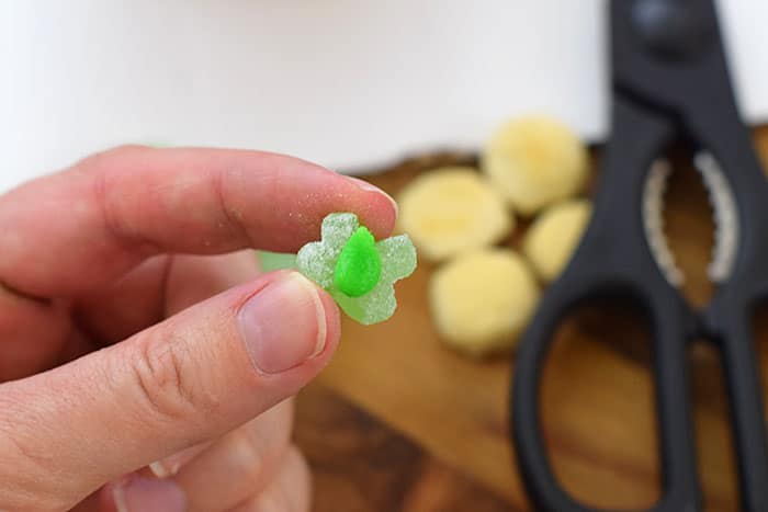 Make a fun and edible kids craft this St. Patrick's Day, a Graham Cracker Leprechaun House. Gather rainbow colored candies, Decorating Icing, and graham crackers, and you're all set!