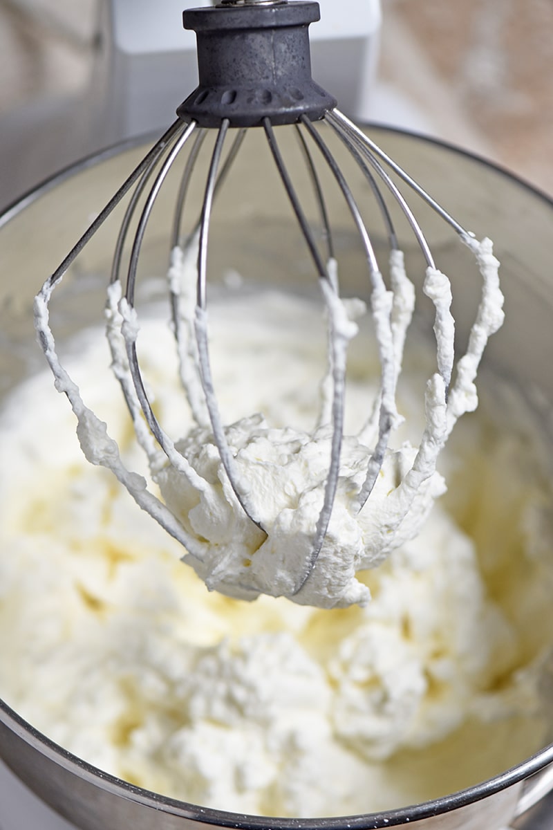 How to make homemade Peppermint Whipped Cream for a minty dessert and hot chocolate topping. Adds a whole new meaning to the word creamy on all your favorite holiday desserts!