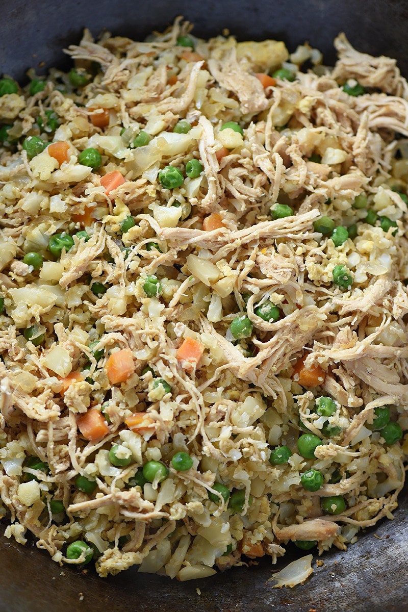 Forget takeout and make a healthier dinner at home with Cauliflower Chicken Fried Rice. It’s one meal my guys can’t get enough of, and it’s so delicious!
