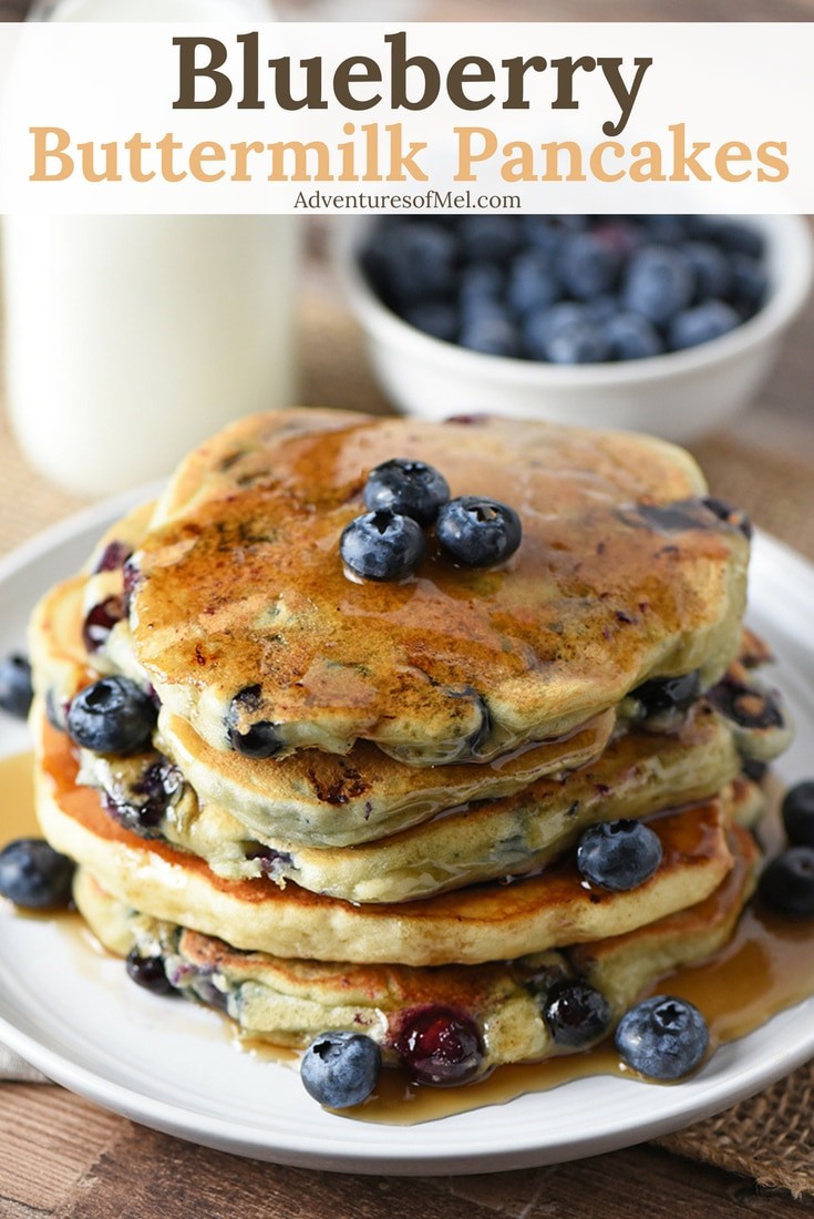 Stack of Blueberry Buttermilk Pancakes with warm maple syrup