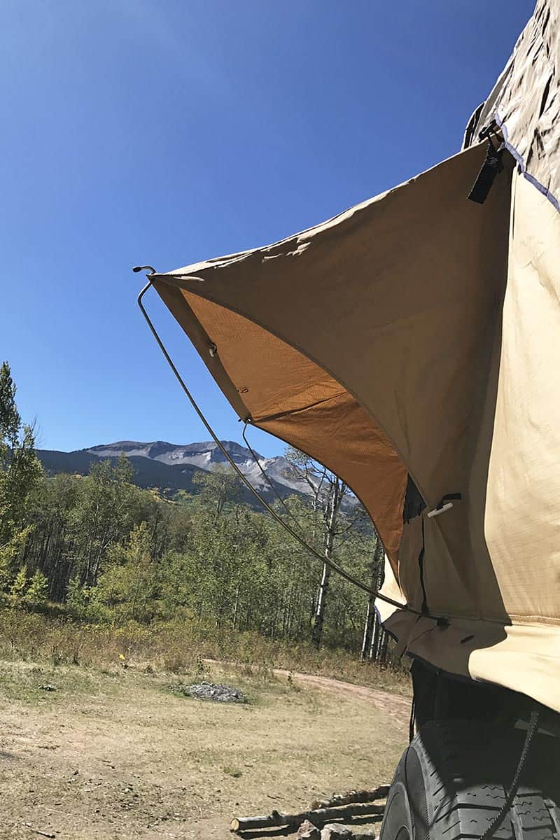 rooftop tent camping in Colorado with camping gear for dispersed camping