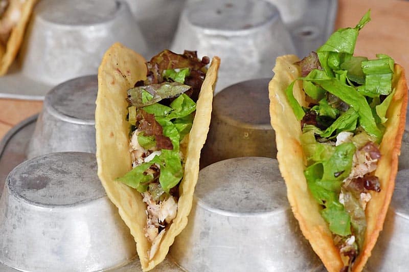 add layer of lettuce to fish tacos