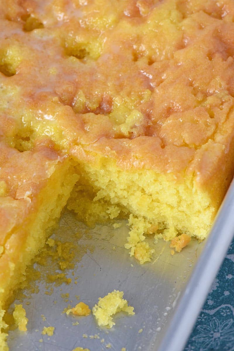 lemon poke cake in a cake pan