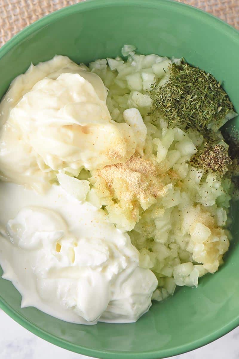 ingredients for tzatziki sauce recipe in green pioneer woman mixing bowl