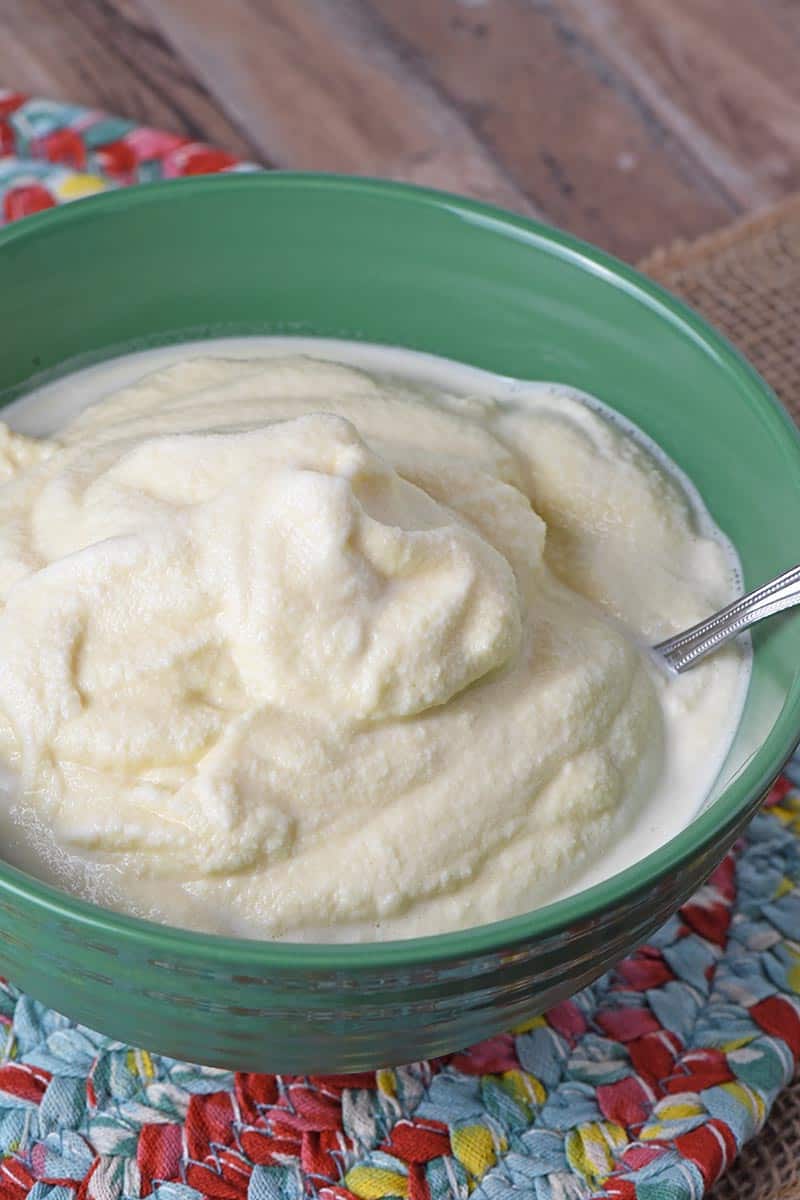 green bowl full of homemade vanilla ice cream