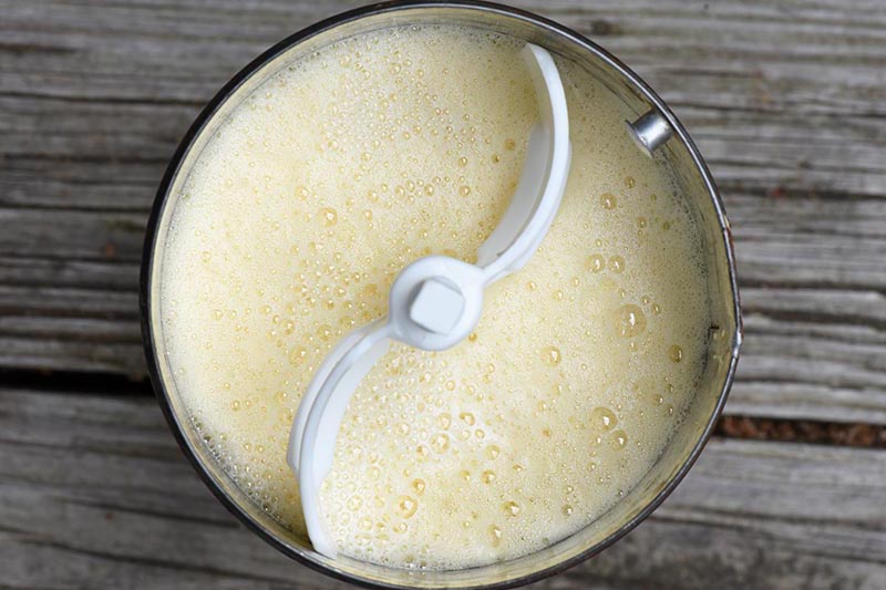 filled ice cream maker canister with old fashioned ice cream mixture