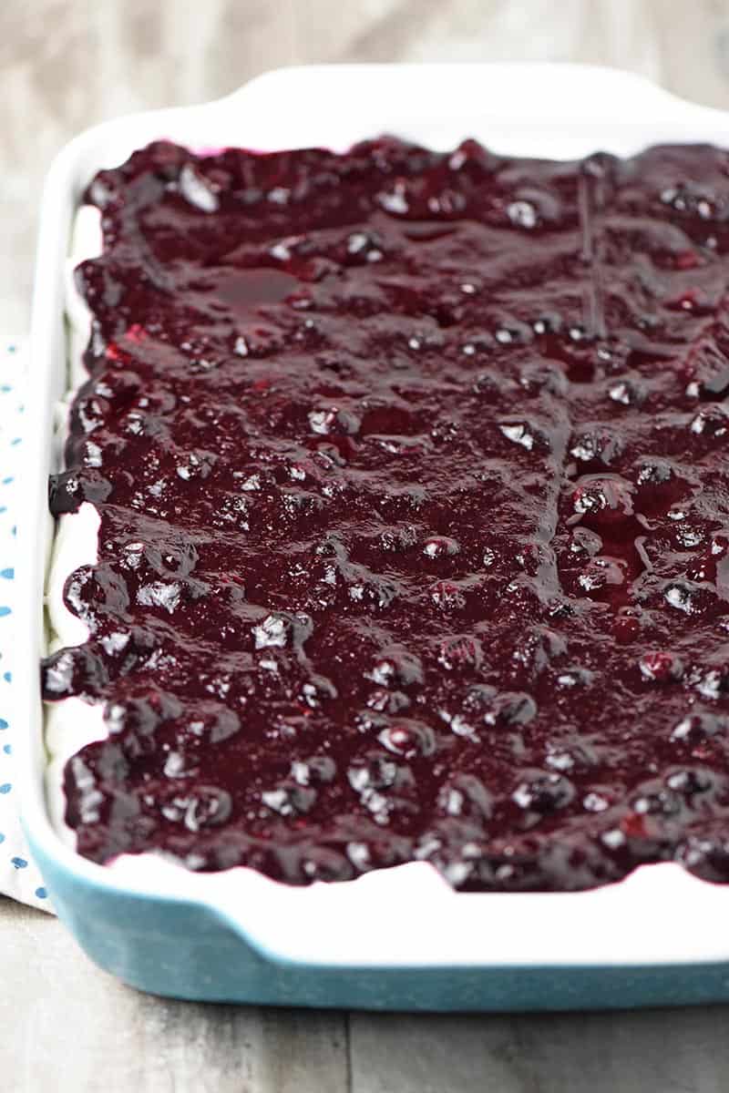 no bake blueberry Dream Whip dessert in blue rectangular baking dish