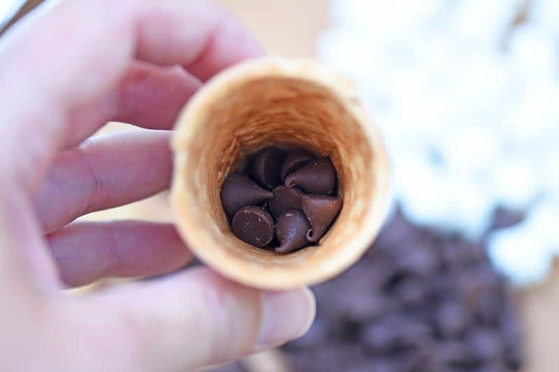 chocolate chips layered in sugar cone for s'mores cones